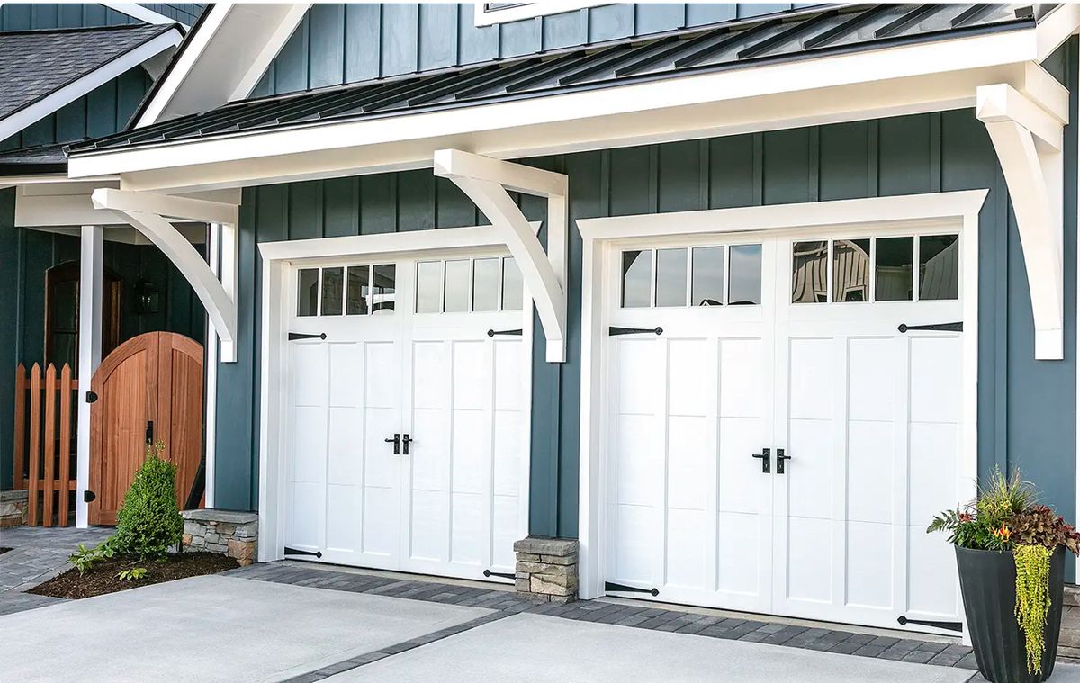 Large double garage door and driveway of an upscale home